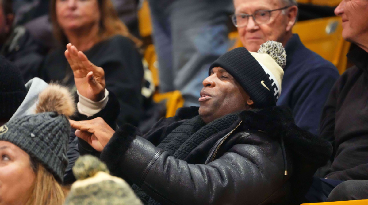 Colorado football coach Deion Sanders cheers on the Buffaloes’ men’s basketball team.